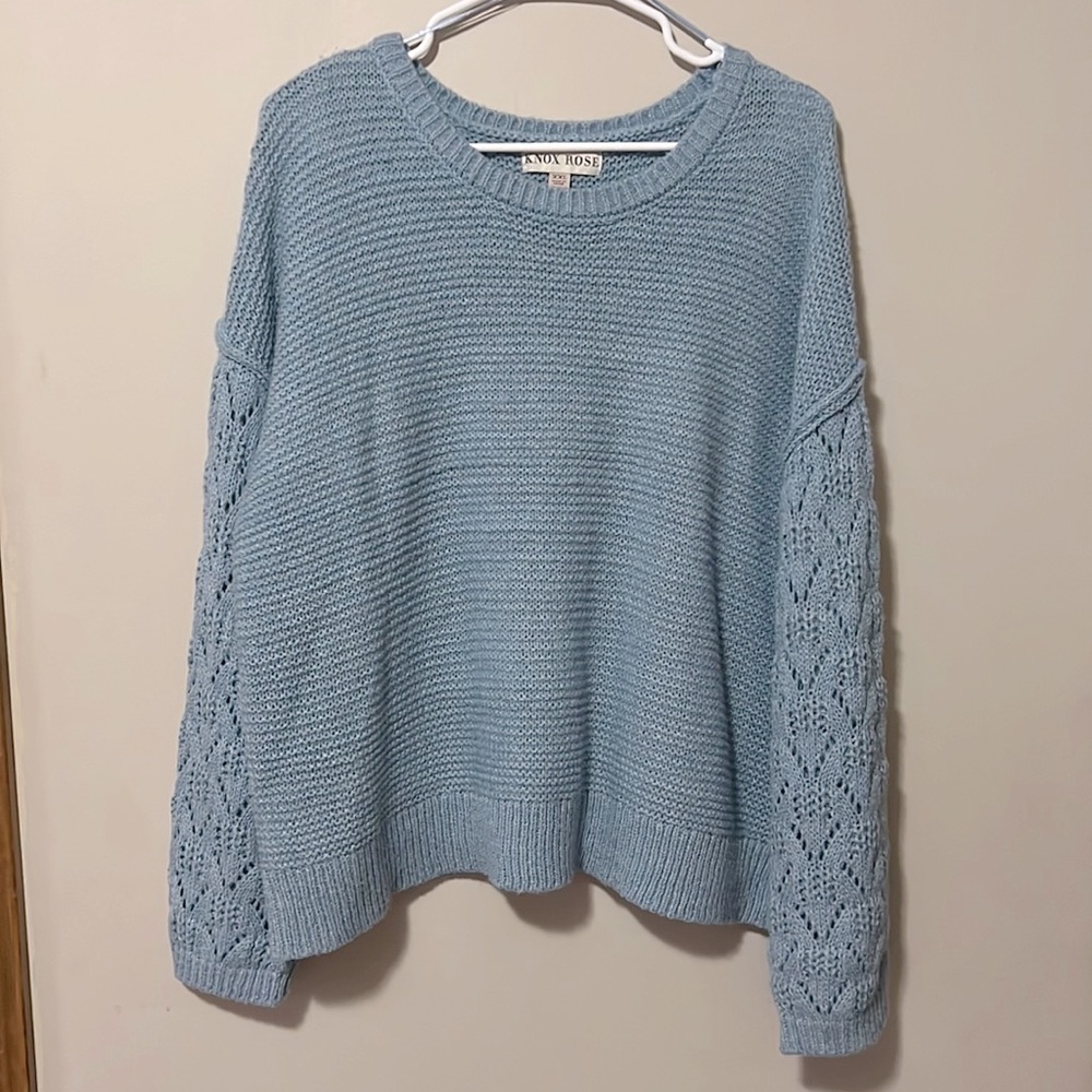 light blue sweater with detailed sleeves
